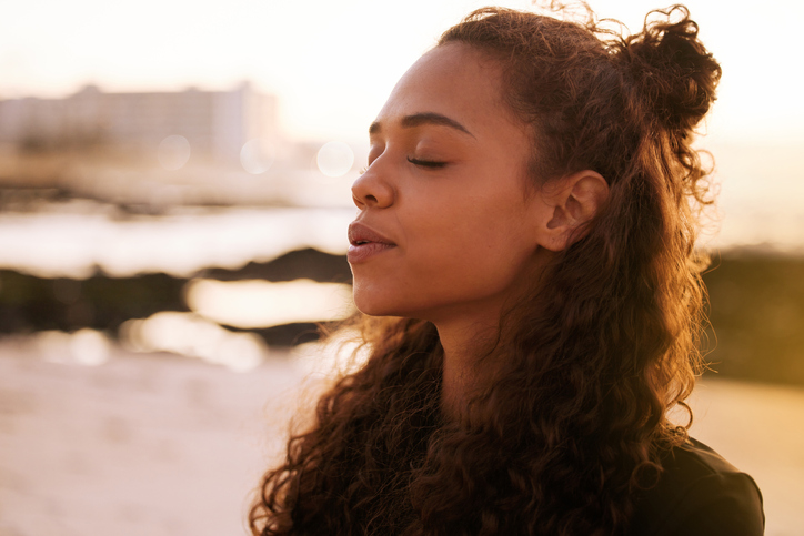 Woman taking a deep breath