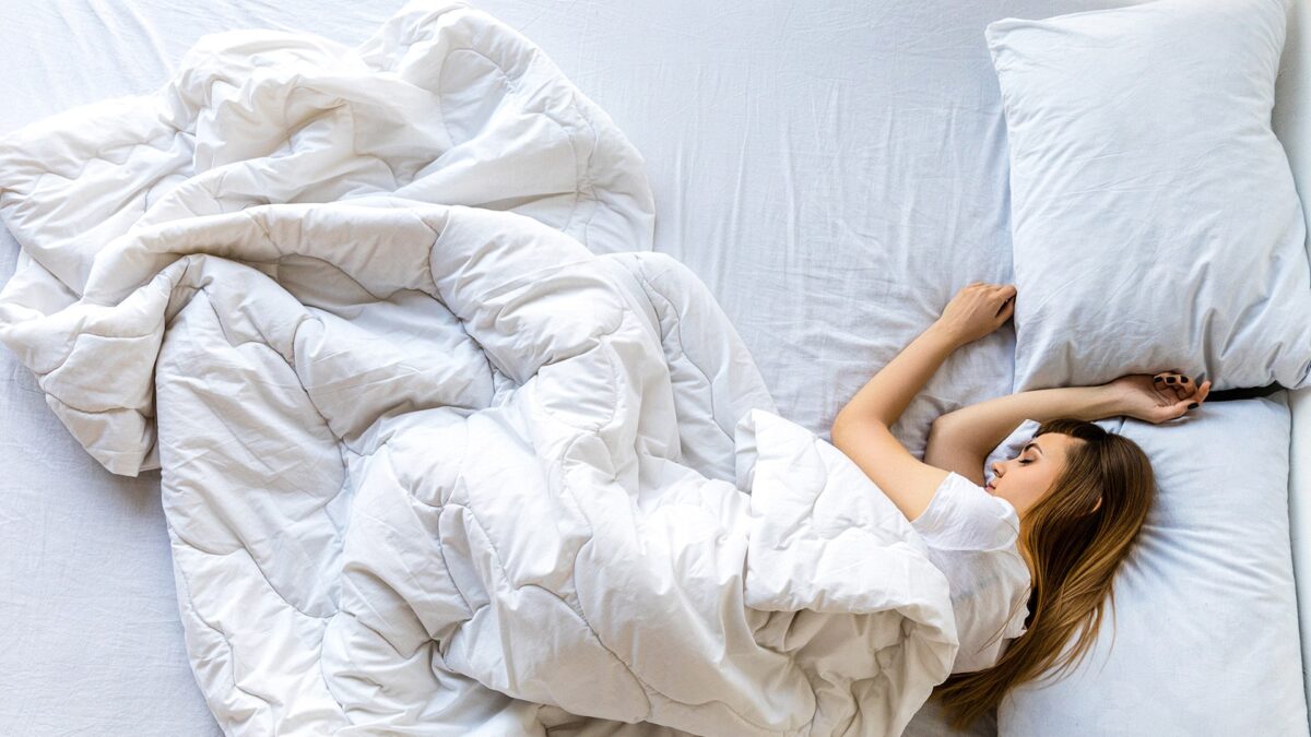 Women sleeping in bed alone