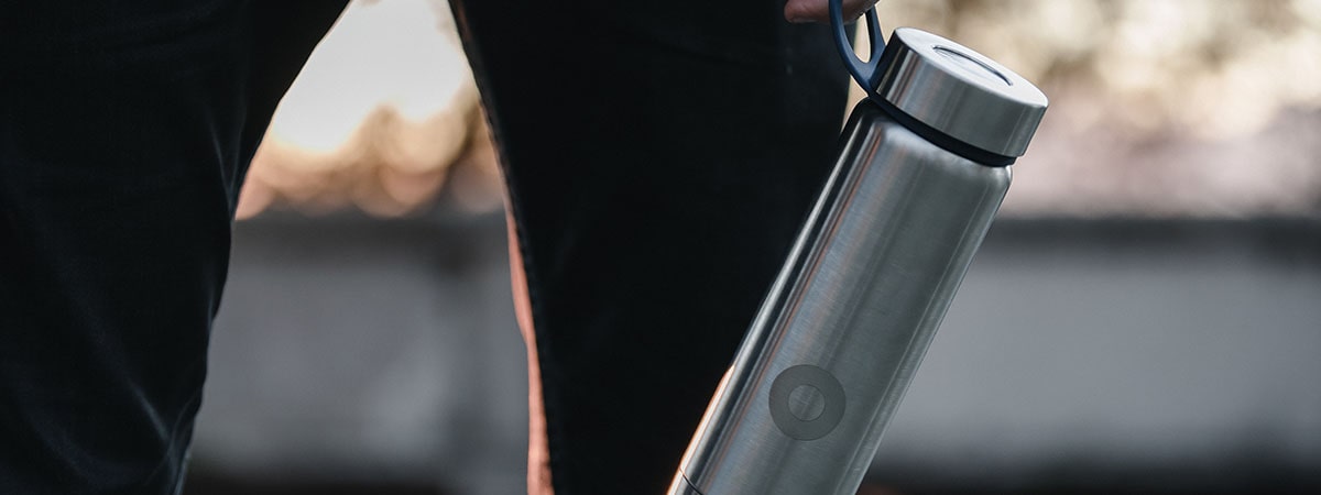 man holding his tumbler