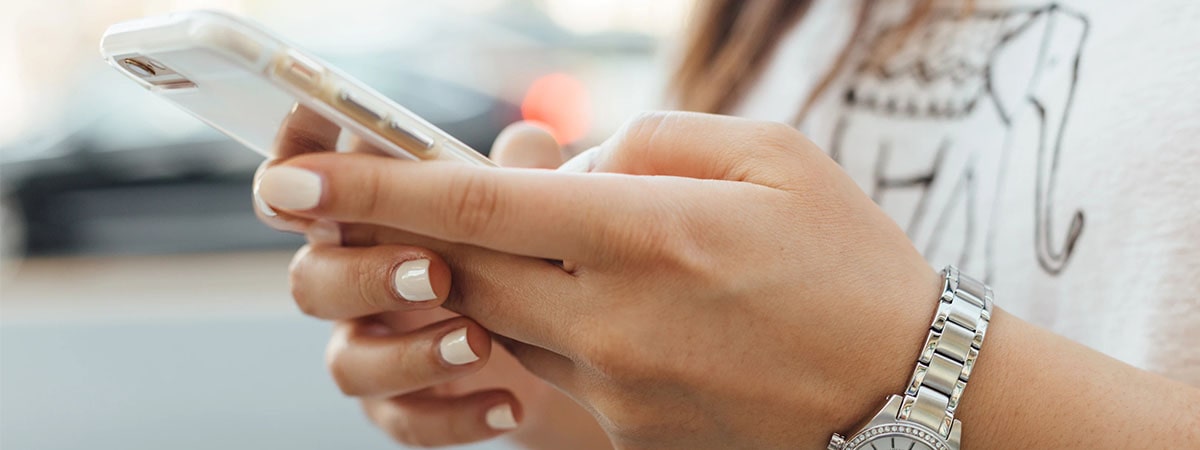 a woman holding her phone